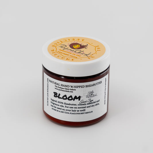 Jar of natural hand and whipped shea butter with a visible brand label on a white background