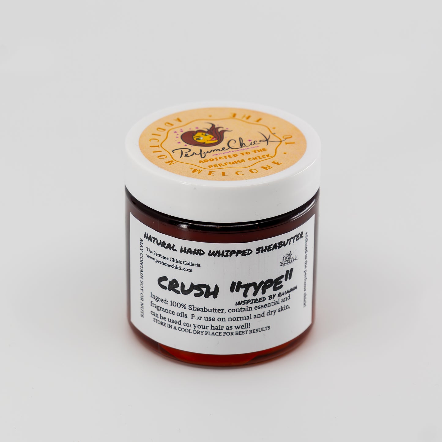 Jar of natural hand whipped shea butter with a visible brand label on a white background