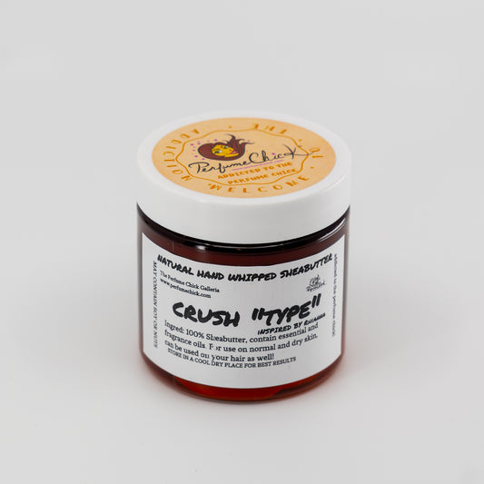 Jar of natural hand whipped shea butter with a visible brand label on a white background